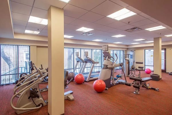 Interior view of a fitness room with exercise equipment