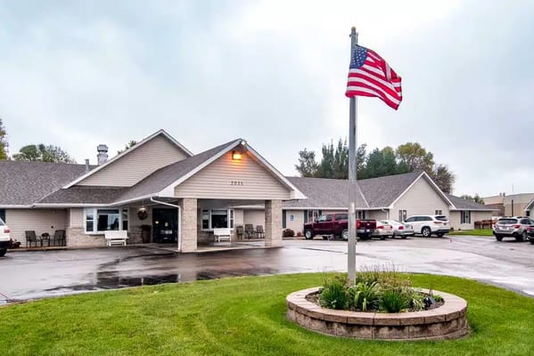 Exterior view of Edgewood Brookings with American flag