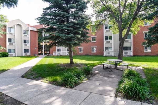 Exterior view of the facility with lawn and pathway