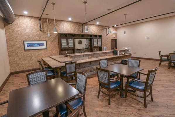 Interior dining area with tables and a serving counter