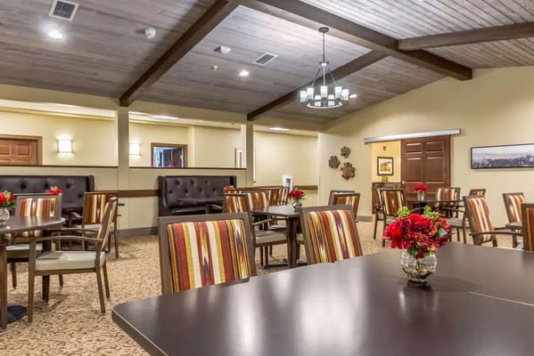 Views of the dining area with tables and floral centerpieces