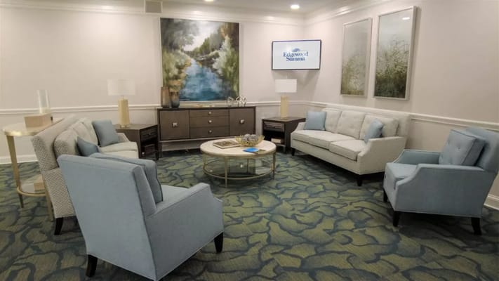 A cozy common area with blue furniture and décor