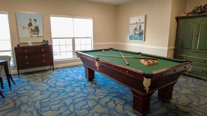 Interior view of a billiards room with a pool table