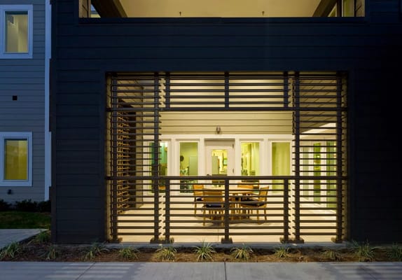 Outdoor view of a shaded seating area with tables