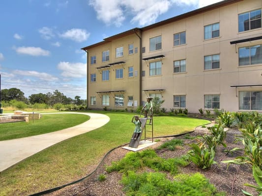 Exterior view of the facility with landscaped garden