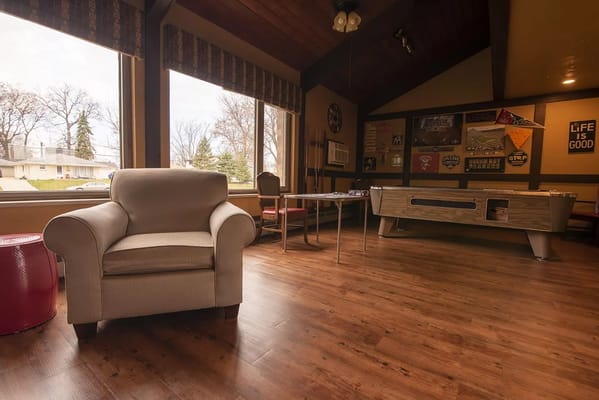 Cozy lounge area with seating and game table