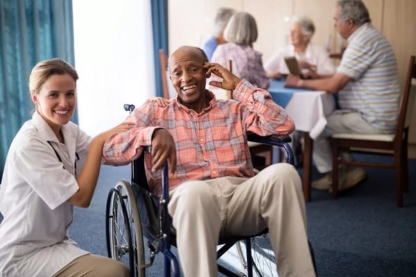 Resident and caregiver interacting in a common area