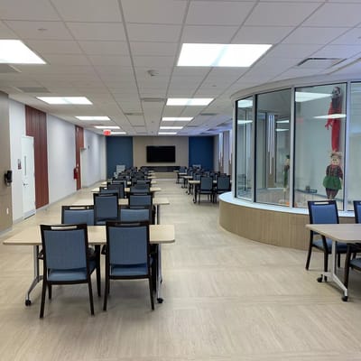 Bright interior of a common area with tables and chairs
