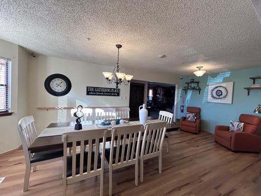 Dining room setup with wooden table and chairs