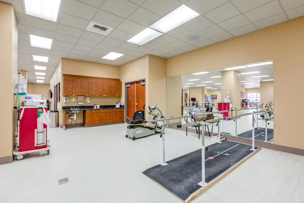 Interior view of a rehabilitation space with exercise equipment