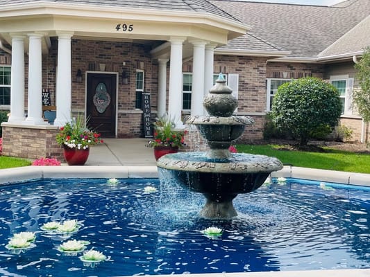 Outdoor fountain in front of a senior care facility