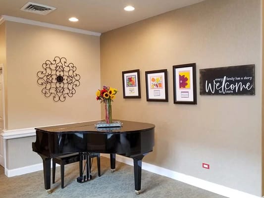 Piano and welcome decor in a common area