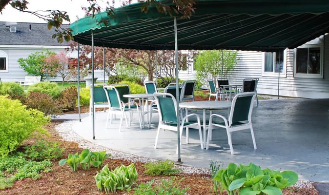 Outdoor seating area with tables and chairs