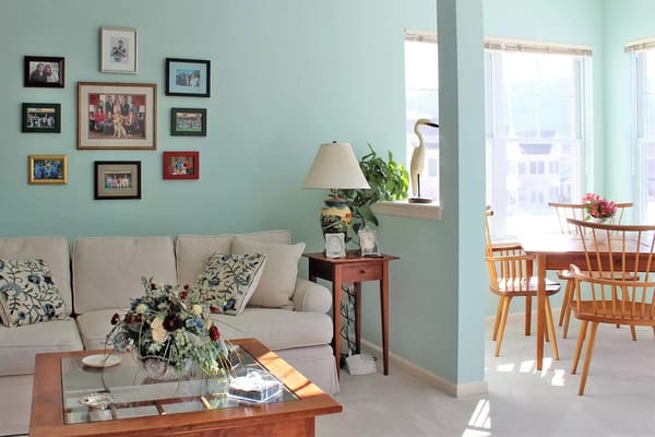 Bright, cozy living space with decorations and a dining area