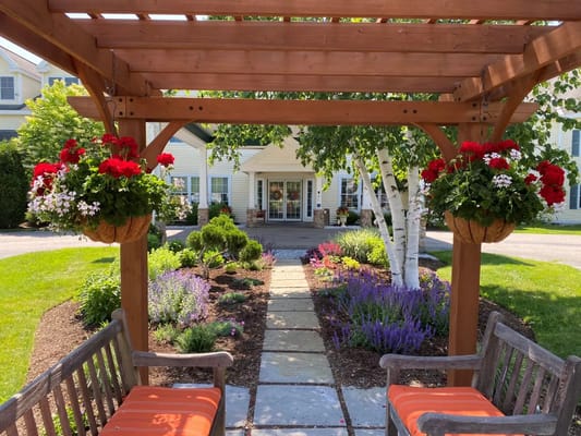 Entrance pathway with flowers leading to the facility