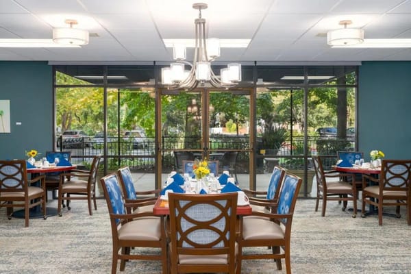 Dining area with decorated tables and outdoor view