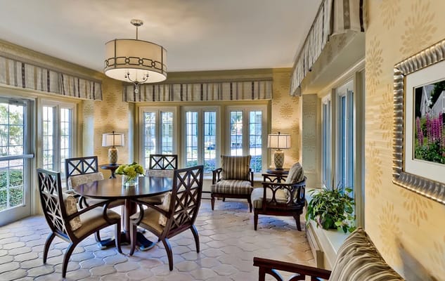 Bright common area with dining table and seating