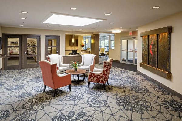 A cozy common area with seating and natural lighting