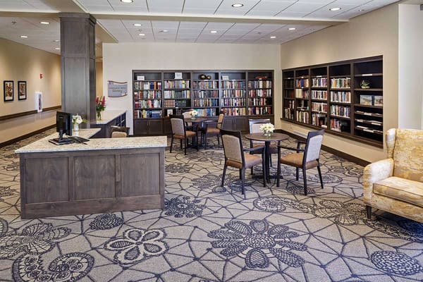 Bright interior common area with bookshelves and seating