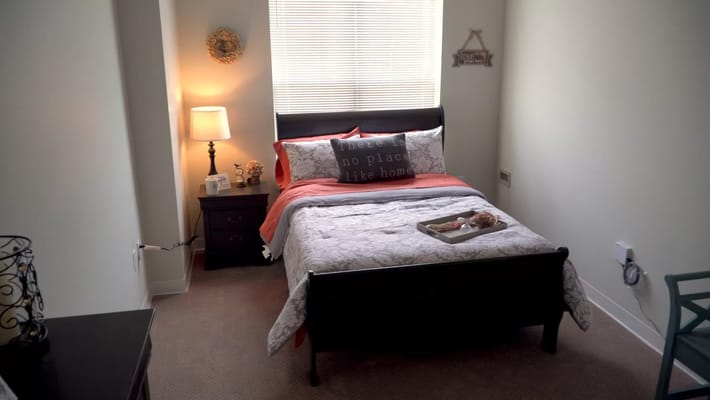 Cozy private resident room with bedding and decor