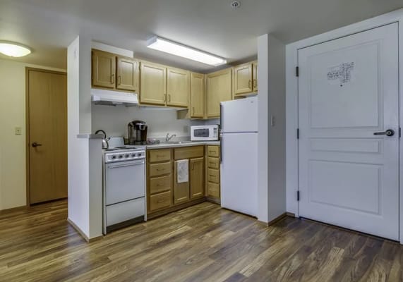 Bright interior of a kitchenette area with appliances