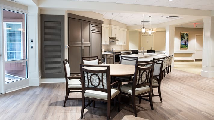 Bright kitchen and dining area with a large table and stylish chairs