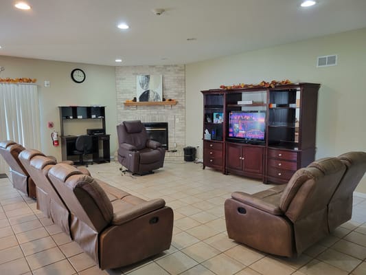 Common area with seating and television.