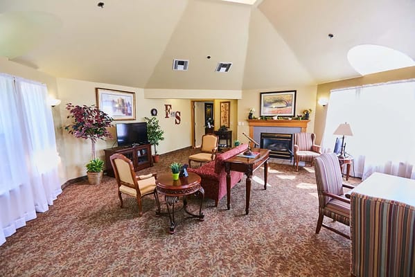 Bright common area with comfortable seating and TV