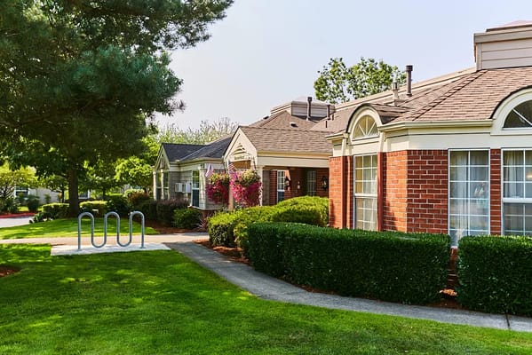 Exterior view of residential buildings with gardens