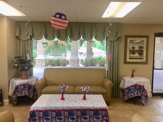 A decorated common area with festive furnishings