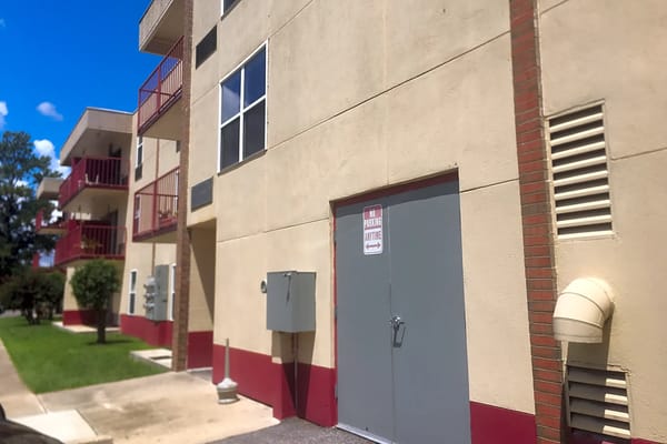 Exterior view of Federation Towers showing a stairwell and door.