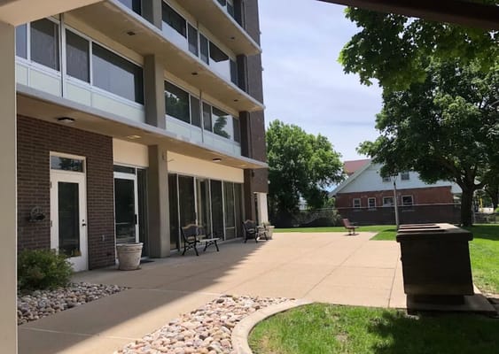 Outdoor patio with seating and landscaped area