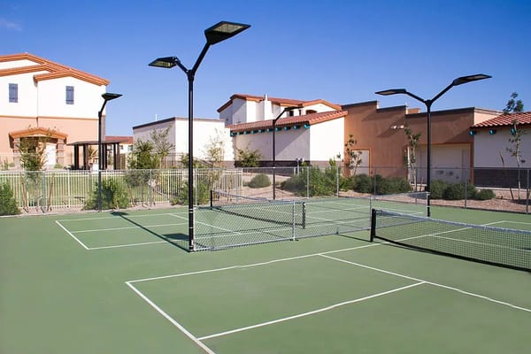 Outdoor tennis courts at a senior living facility