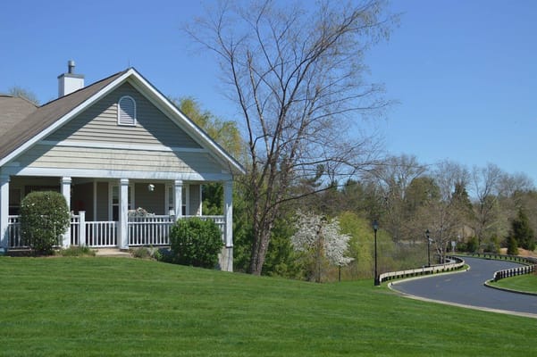 Beautiful exterior of a building at Fellowship Village with surrounding greenery.