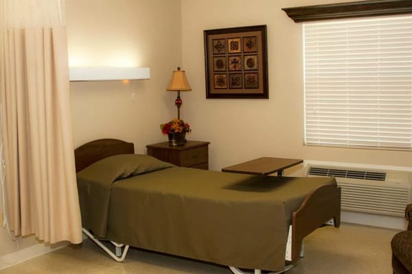 Simple interior room with bed and decorative elements