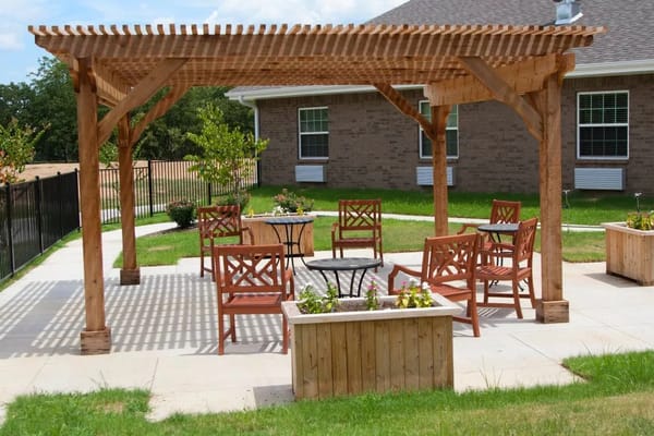 Outdoor seating area with shaded pergola