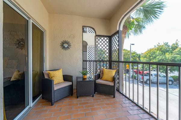 Outdoor balcony with seating and potted plant