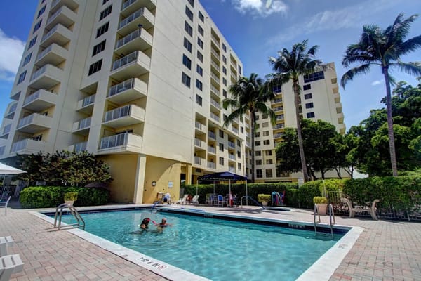 Residents enjoying the pool area at The Pointe