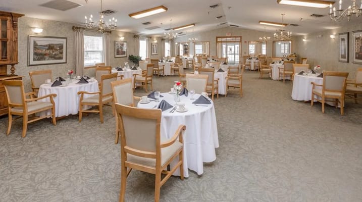 Well-set dining tables in a spacious dining room