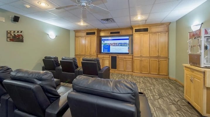 Cozy common area with theater seating for residents