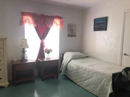 A private resident room with a bed and furniture