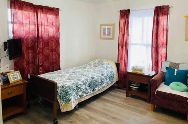 Cozy private resident room with bed and furnishings