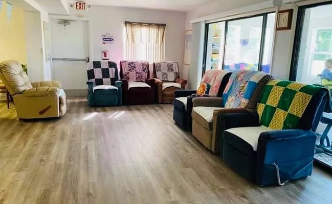 Common area with comfortable seating and quilts