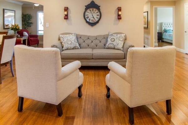 A cozy interior living area with a couch and chairs