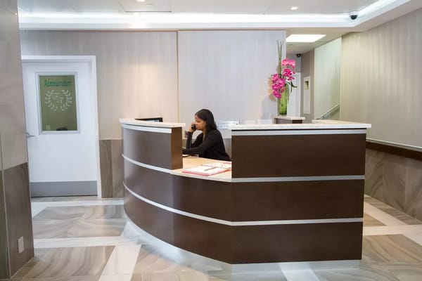 Reception area with a staff member at the desk