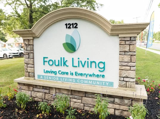 Foulk Living facility sign with logo displayed