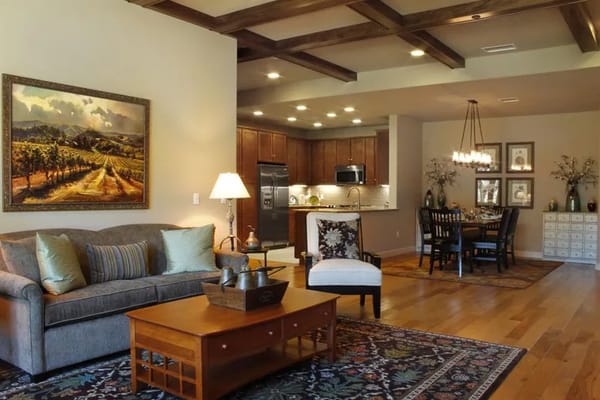 Spacious living room with comfortable seating and modern kitchen area