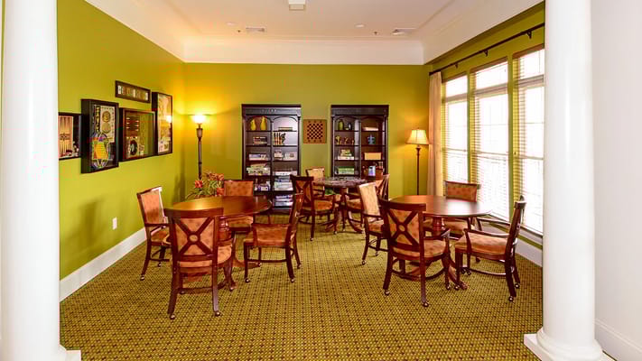 Bright common area with seating and shelves
