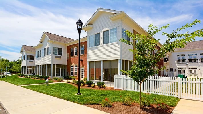 Exterior view of a senior living facility with landscaping