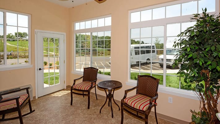 Bright interior common area with seating and large windows